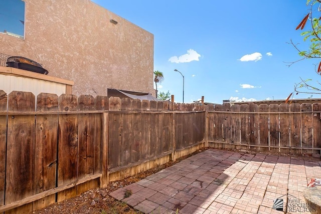 view of patio / terrace featuring fence private yard