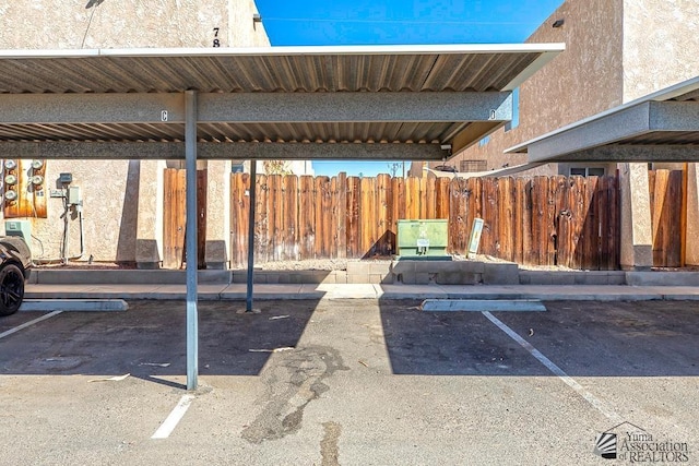 covered parking lot with fence