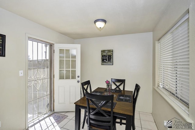 dining area with light tile patterned floors