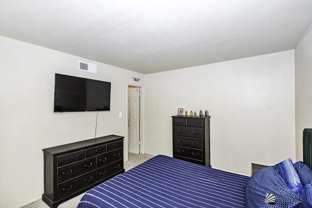 carpeted bedroom with visible vents