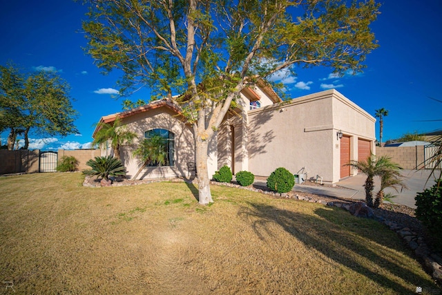 view of front of property with a garage and a front yard