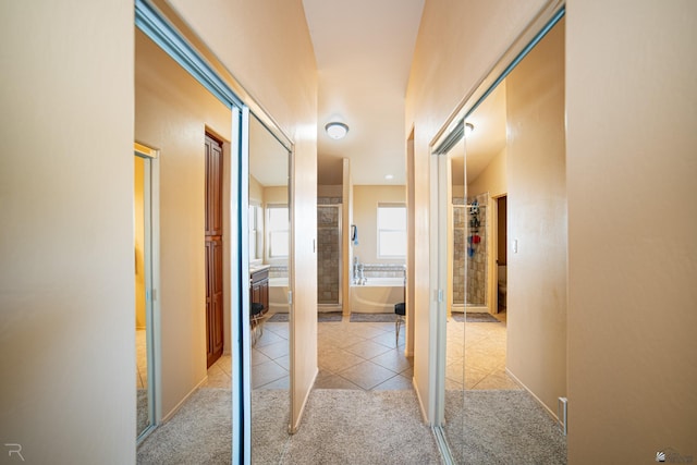 corridor with light colored carpet