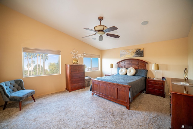 carpeted bedroom featuring lofted ceiling and ceiling fan