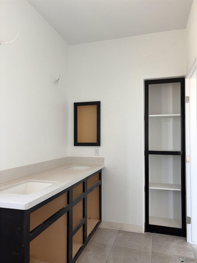 interior space featuring tile patterned floors and vanity