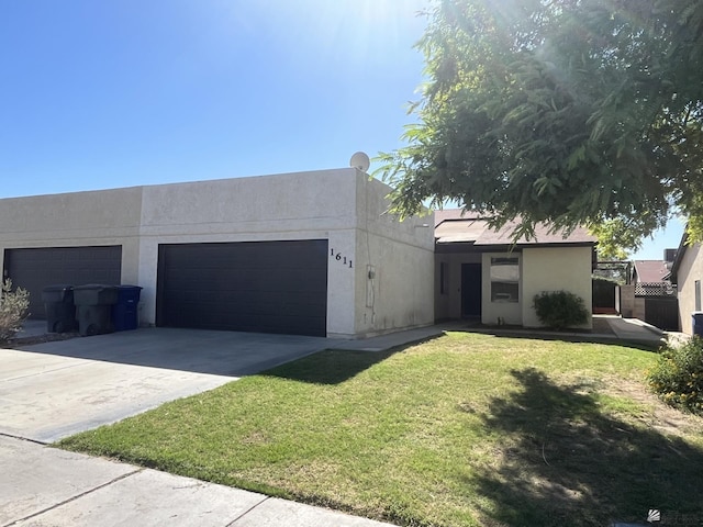 view of front facade featuring a garage and a front lawn