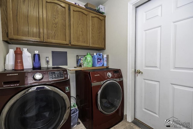 laundry room featuring washing machine and dryer and cabinet space