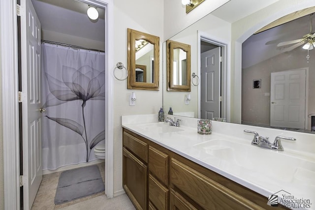 full bath featuring a ceiling fan, a sink, toilet, and double vanity