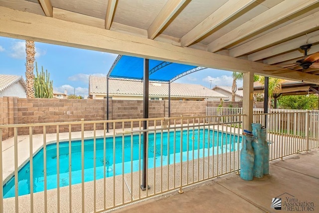 view of swimming pool with a patio, a fenced backyard, and a fenced in pool