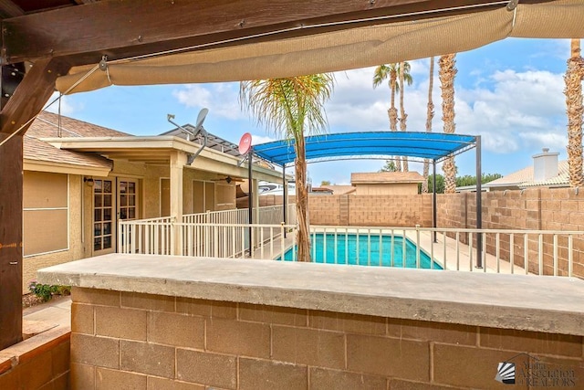 view of pool featuring a patio area, a fenced backyard, and a fenced in pool