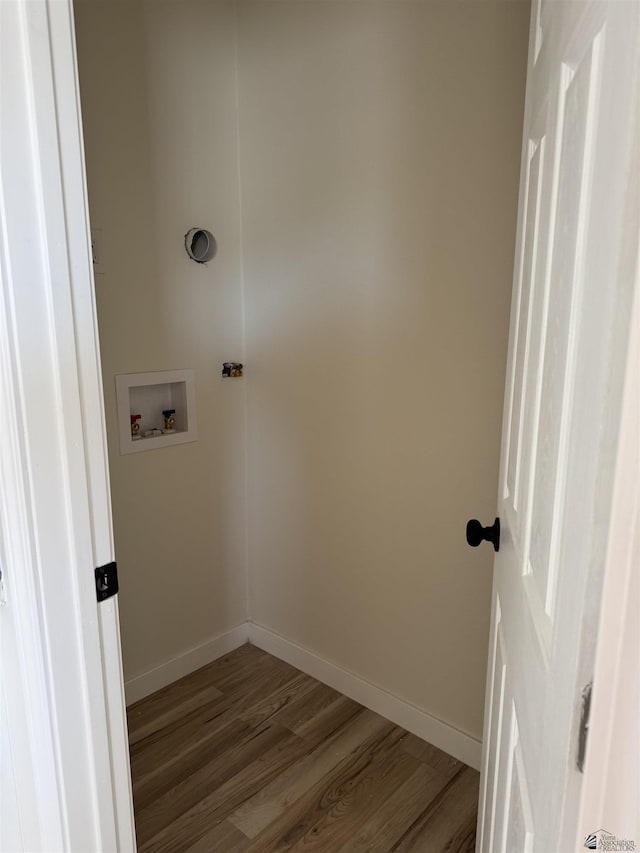 clothes washing area with hookup for a washing machine and wood-type flooring