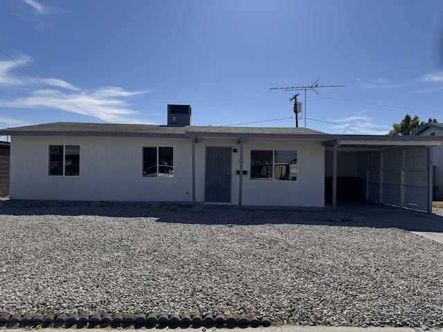 view of front of property with a carport