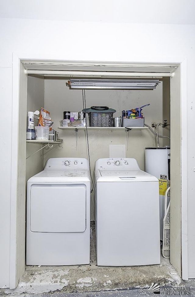 laundry area with water heater, laundry area, and independent washer and dryer