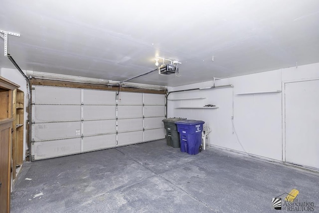 garage featuring a garage door opener