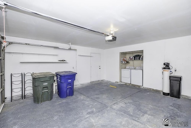 garage featuring washer and clothes dryer and a garage door opener