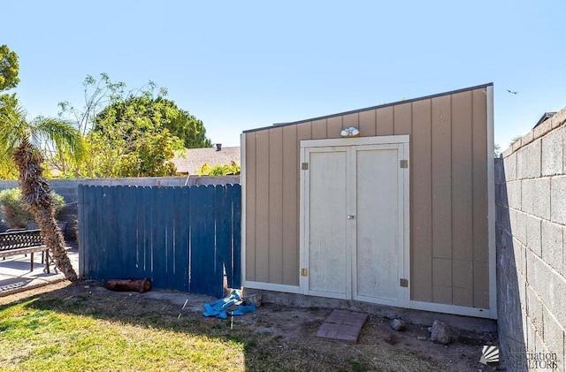 view of shed with fence