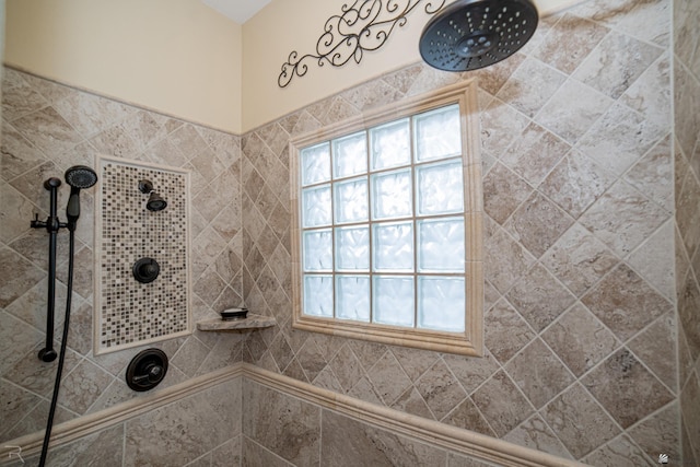 bathroom with a tile shower