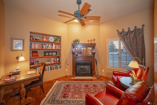 sitting room featuring ceiling fan and wood-type flooring