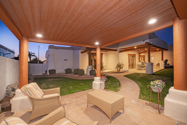 patio terrace at dusk with a yard