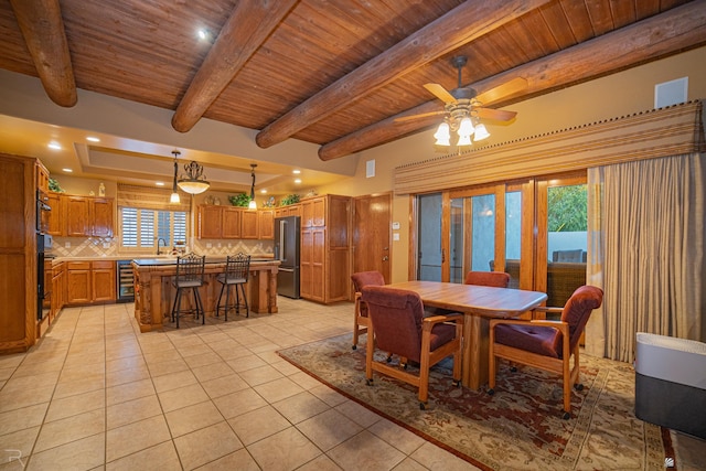 dining room with light tile patterned flooring, beamed ceiling, beverage cooler, and wooden ceiling