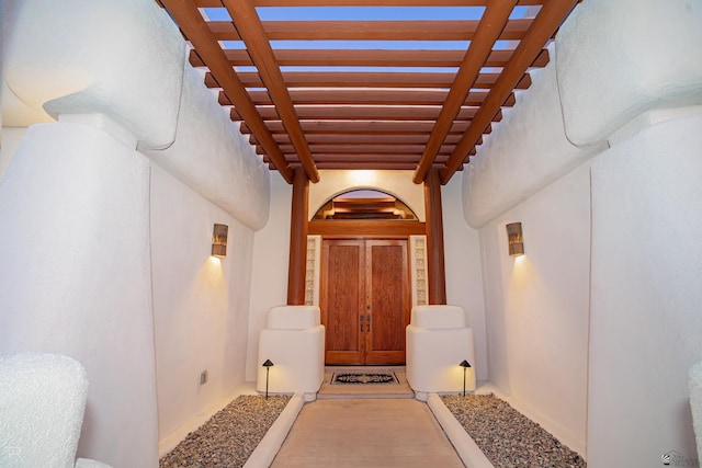 property entrance featuring a pergola