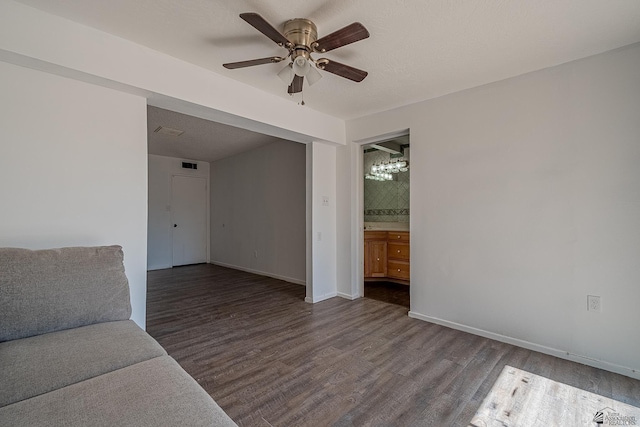 unfurnished living room featuring ceiling fan and wood-type flooring