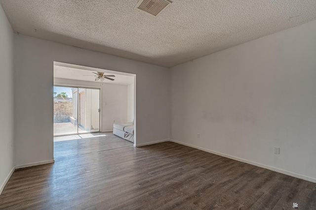 empty room with hardwood / wood-style floors, ceiling fan, and a textured ceiling