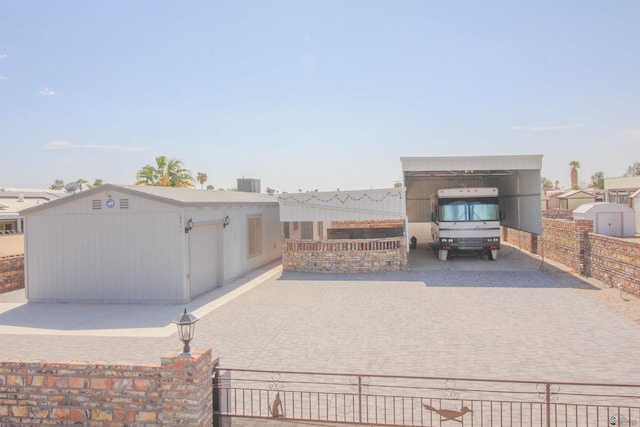 view of patio / terrace with an outdoor structure and central AC