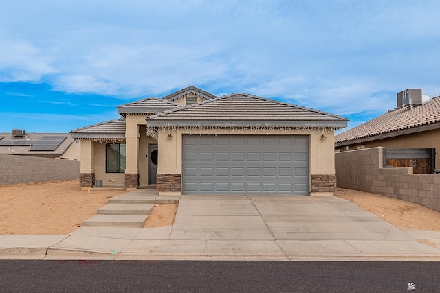 view of front of home with a garage