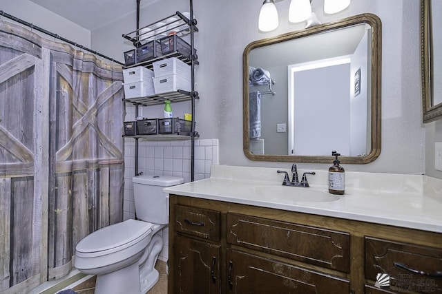 full bathroom with vanity and toilet