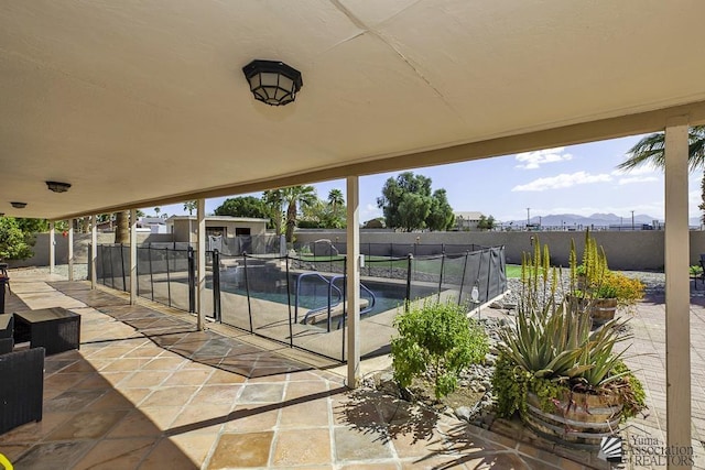 view of patio featuring a fenced backyard and a fenced in pool