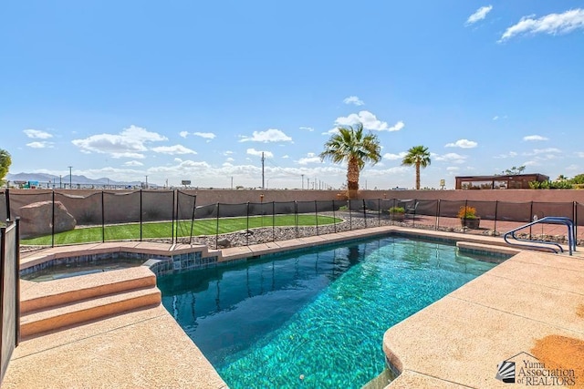 view of swimming pool with an in ground hot tub, a fenced backyard, and a fenced in pool