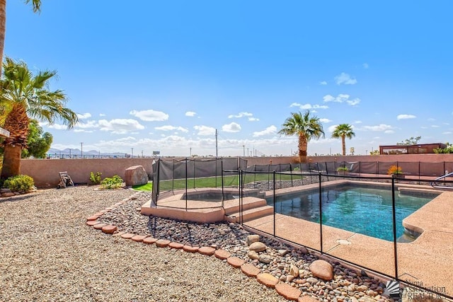 view of pool with a fenced backyard and a fenced in pool