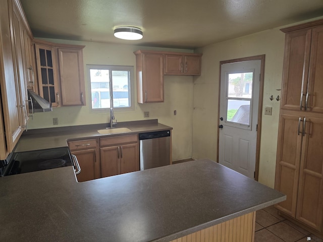 kitchen with sink, light tile patterned floors, plenty of natural light, and stainless steel appliances