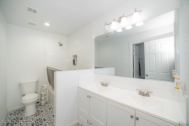 full bathroom featuring toilet, vanity, tile patterned floors, and shower / bath combination with curtain