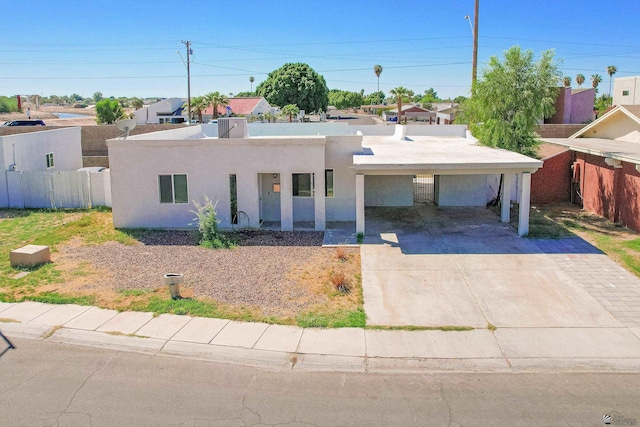 view of front of home featuring a carport