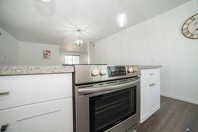 kitchen featuring pendant lighting, white cabinetry, dark hardwood / wood-style floors, and stainless steel electric range oven