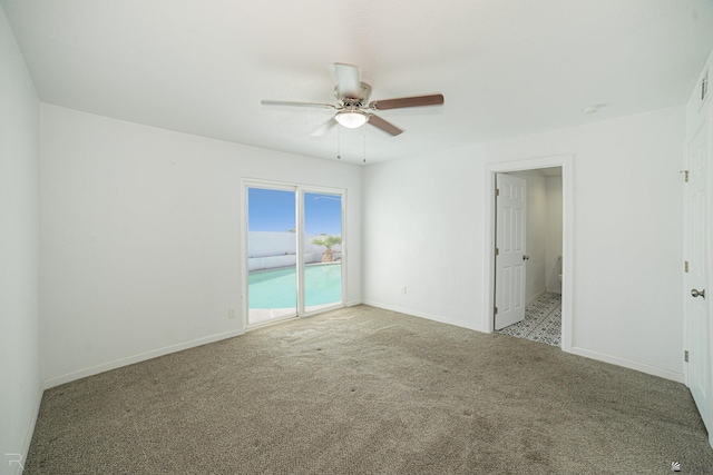 empty room featuring light carpet and ceiling fan