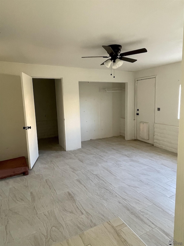 unfurnished bedroom featuring ceiling fan