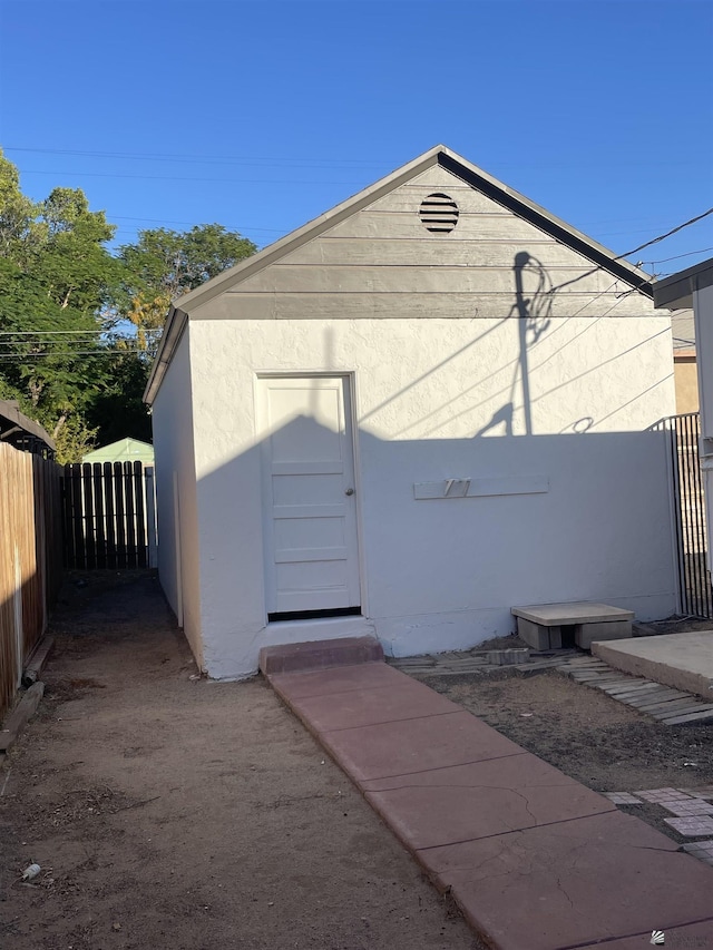 view of outdoor structure with fence