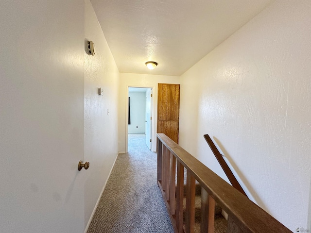 corridor with light colored carpet