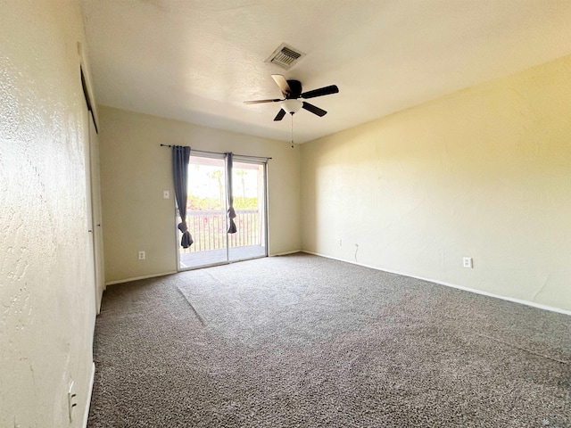 carpeted empty room featuring ceiling fan