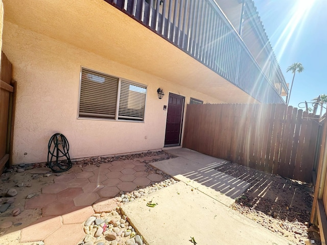 entrance to property with a patio area