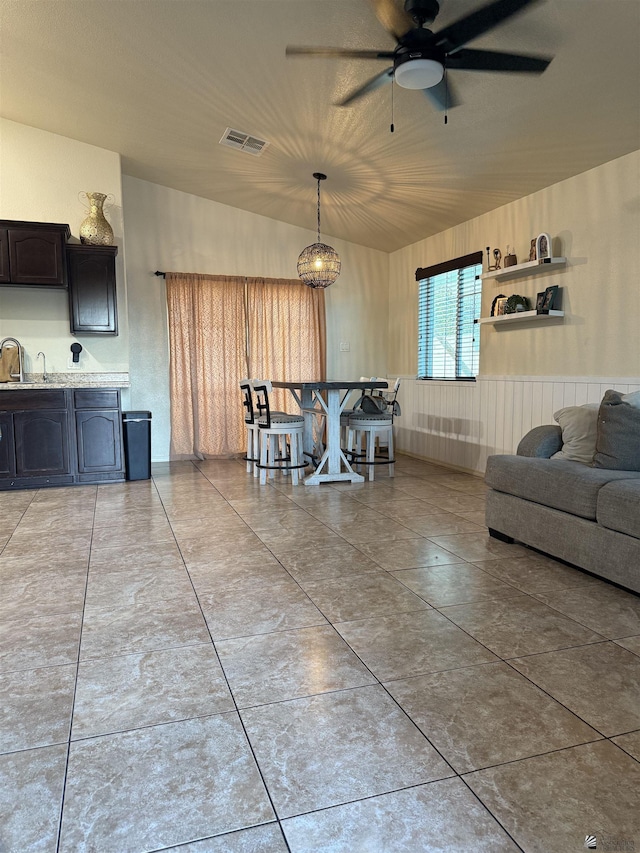 dining space featuring ceiling fan and visible vents