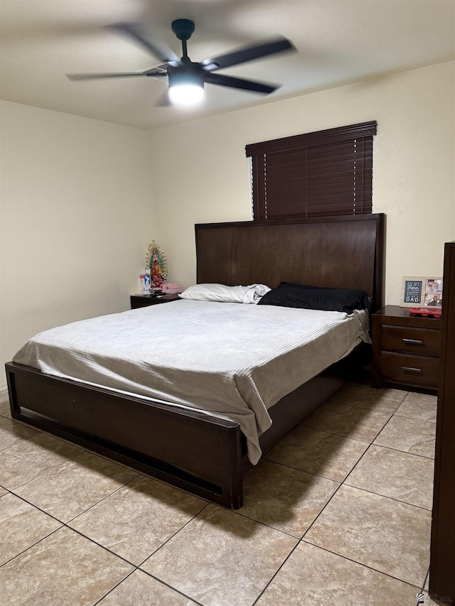 bedroom featuring ceiling fan and light tile patterned floors