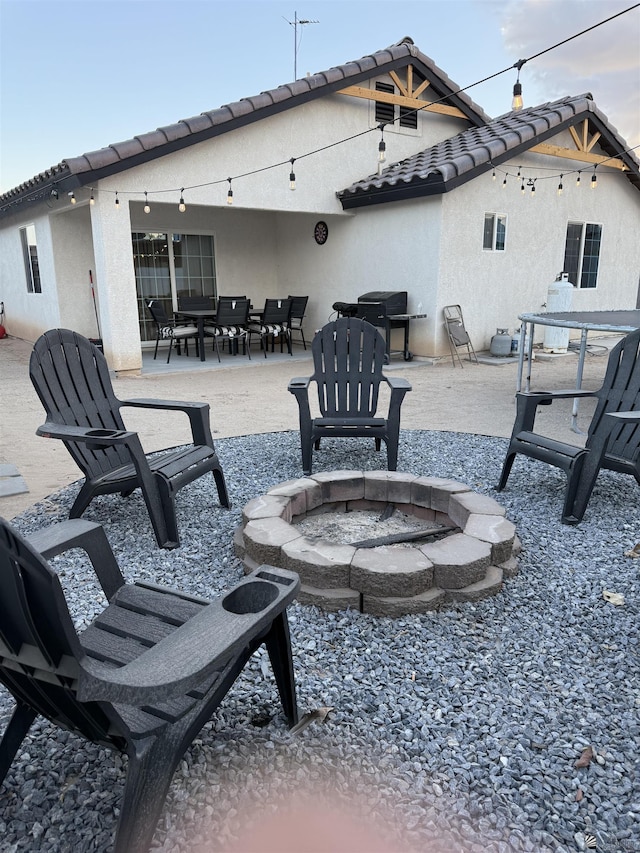 view of patio with a fire pit