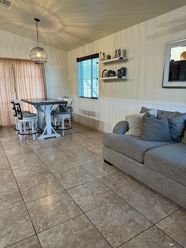 living area with tile patterned flooring and visible vents