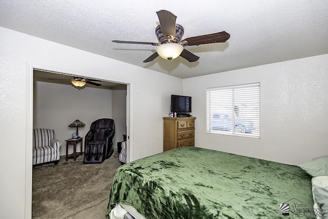 carpeted bedroom with ceiling fan and a textured ceiling