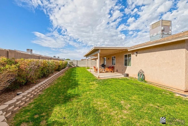 view of yard with a patio and central AC