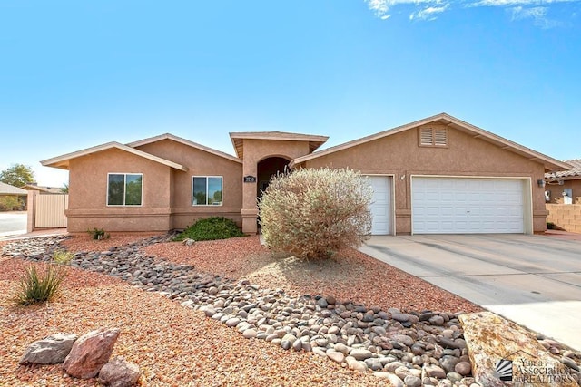 ranch-style home featuring a garage