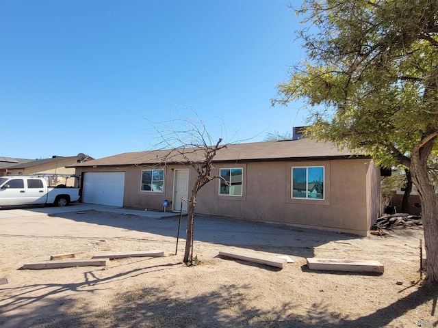 ranch-style house featuring a garage